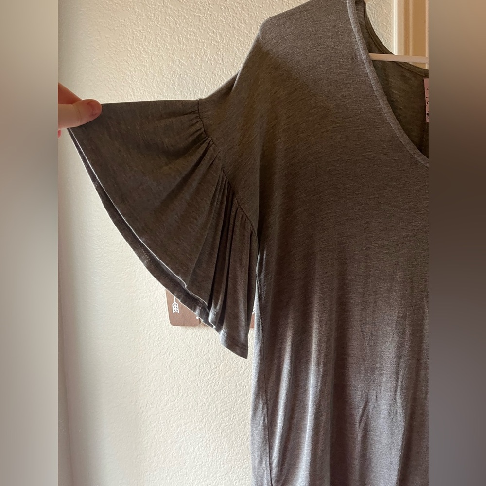 Francesca’s grey butterfly sleeve top